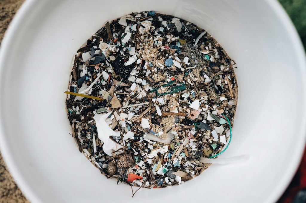 A picture of a bucket filled with microplastics